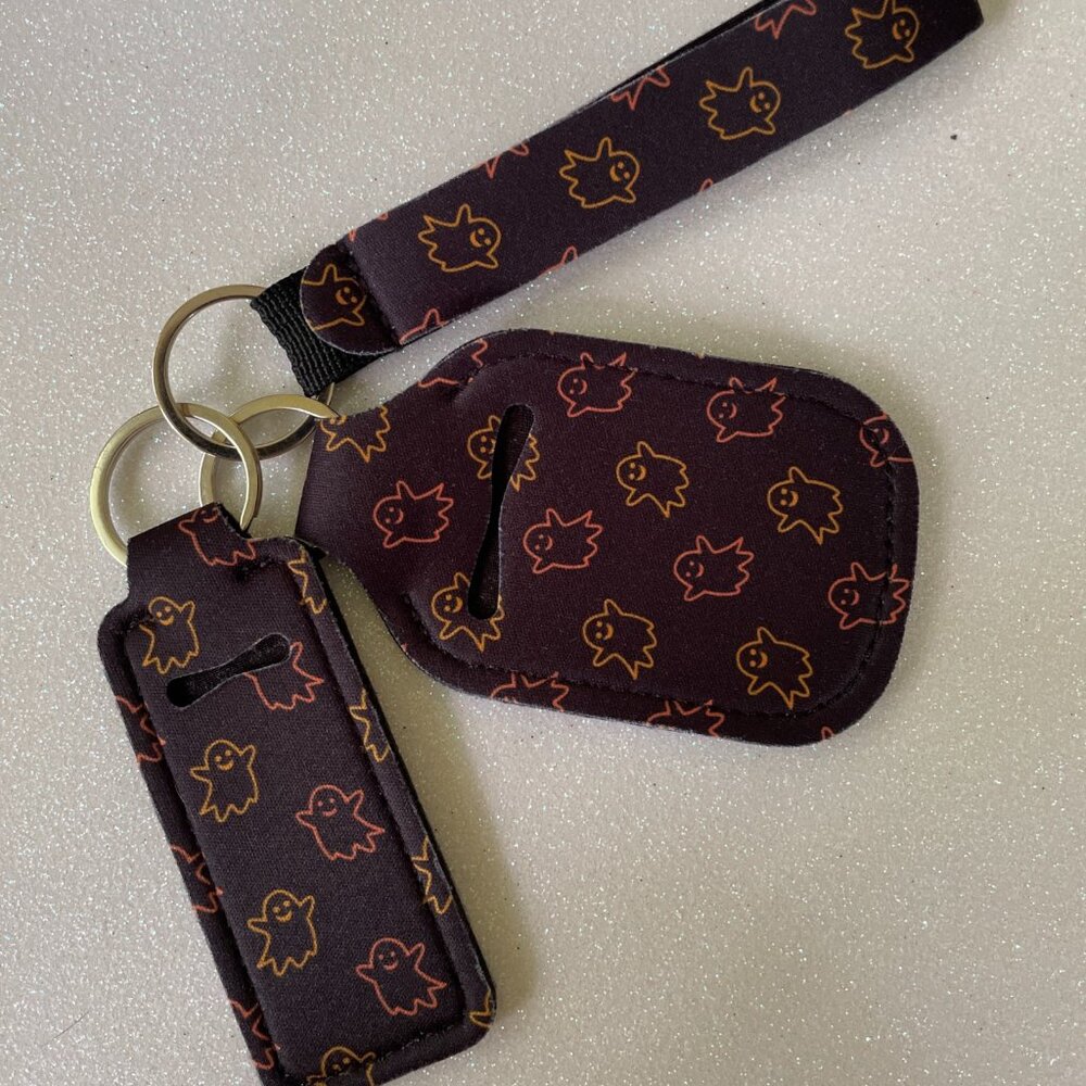 NWOT 3 Piece Neoprene Wristlet, Sanitizer and Lip Balm Holder Keychain Set
